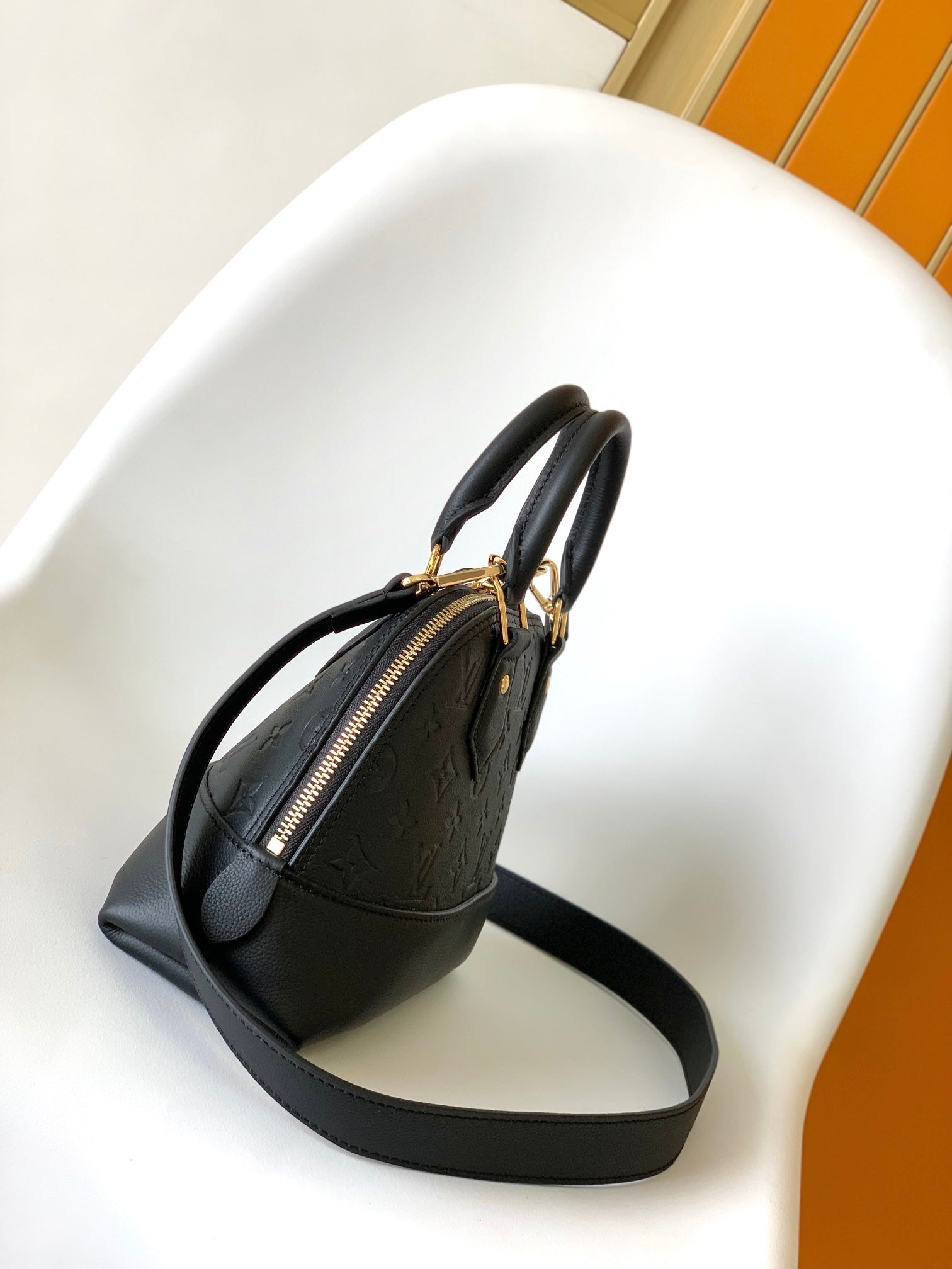 LV Néo Alma BB 44829 Black Monogram Shadow embossed calfskin