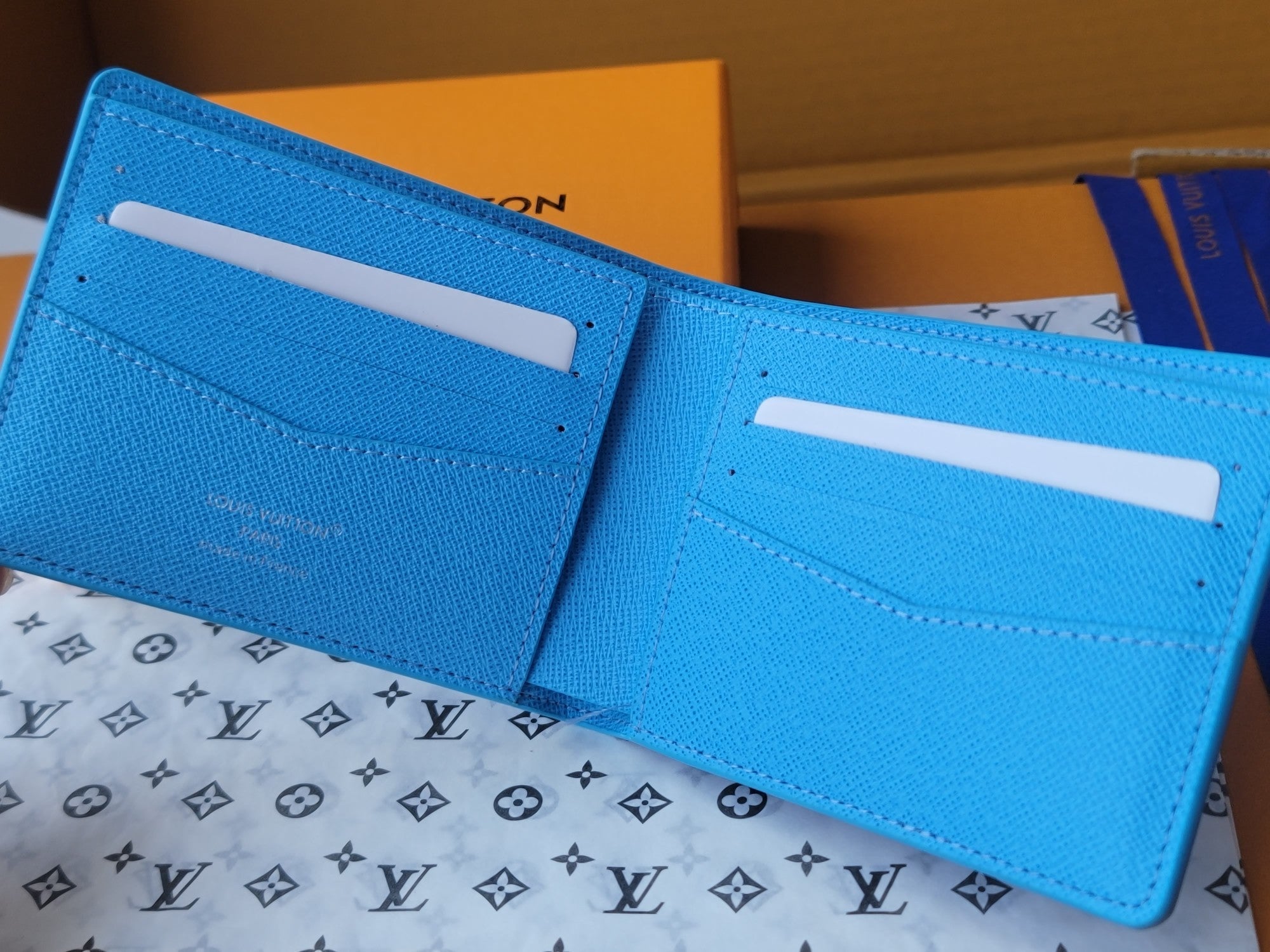 LV Multiple Wallet Featuretiny Sport Scenes Printed Cowhide