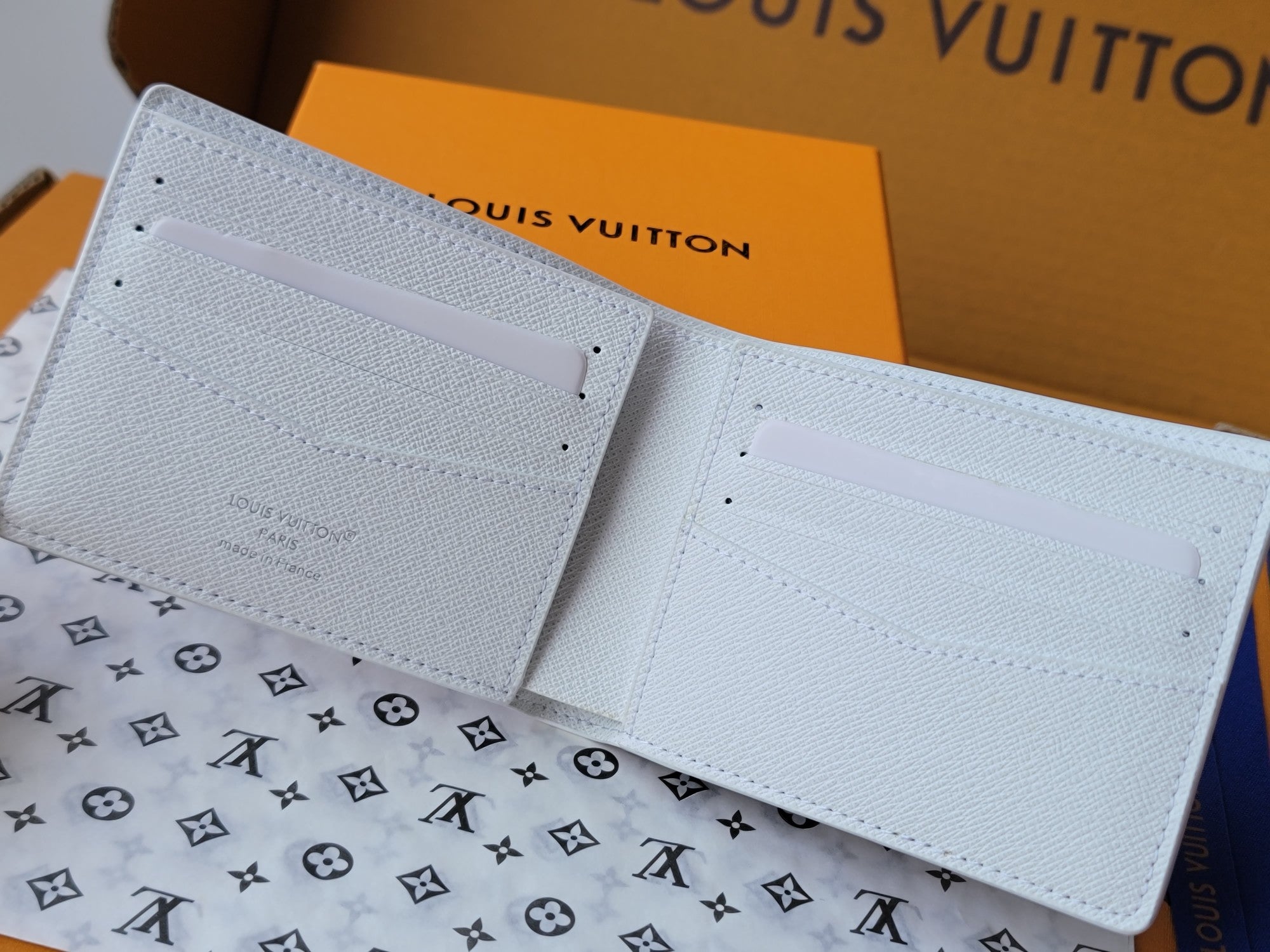 LV Multiple Wallet Featuretiny Sport Scenes Printed Cowhide